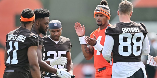 May 25, 2022; Berea, OH, USA; Cleveland Browns quarterback Deshaun Watson (4) calls a play with the offense during organized team activities at CrossCountry Mortgage Campus.