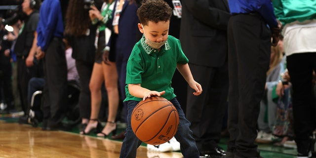 Deuce Tatum plays with a ball before the NBA Finals game between the Celtics and the Golden State Warriors at TD Garden on June 8, 2022, in Boston.