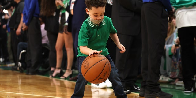 Deuce Tatum plays with a ball before the NBA Finals game between the Celtics and the Golden State Warriors at TD Garden on June 8, 2022, in Boston.