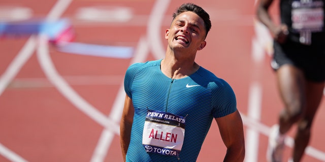Devon Allen wins the men's 100 hurdle elite race during the 126th running of the Penn Relays on April 30, 2022, at Franklin Field in Philadelphia.