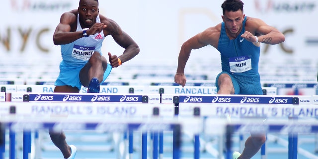 Grant Holloway competes against Devon Allen in the men's 110m hurdle, coming in second during the New York Grand Prix at Icahn Stadium on June 12, 2022, in New York City.