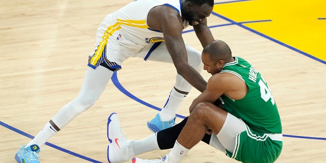 Al Horford of the Boston Celtics and Draymond Green of the Golden State Warriors battle for the ball during the 2022 NBA Finals on June 5, 2022 in San Francisco.