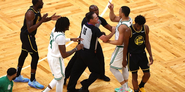 Grant Williams # 12 of the Boston Celtics and Drymond Green # 23 of the Golden State Warriors arguing at the TD Garden in Boston, Massachusetts on June 08, 2022 during the 3 games of the 2022 NBA Finals.