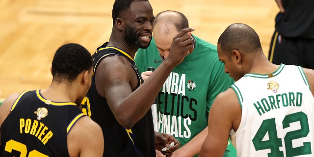Draymond Green of the Golden State Warriors reacts after colliding with Jaylen Brown of the Celtics during the NBA Finals at TD Garden on June 8, 2022, in Boston.