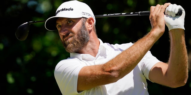 Dustin Johnson hits on the seventh hole during a practice round for the U.S. Open golf tournament at The Country Club, Wednesday, June 15, 2022, in Brookline, Mass. 