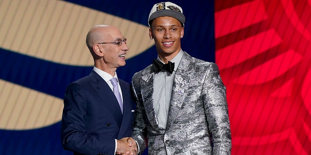Dyson Daniels, right, is congratulated by NBA Commissioner Adam Silver after being selected eighth overall by the New Orleans Pelicans in the NBA basketball draft, Thursday, June 23, 2022, in New York.