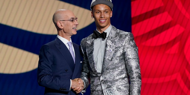 Dyson Daniels, right, is congratulated by NBA Commissioner Adam Silver after being selected eighth overall by the New Orleans Pelicans in the NBA basketball draft, Thursday, June 23, 2022, in New York.