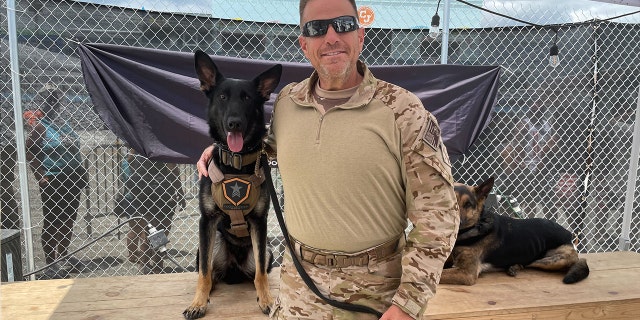 Combat veteran Dave Eckerson poses with Kane, his new service animal.