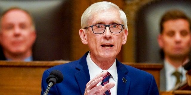 Wisconsin Gov. Tony Evers addresses a joint session of the Legislature in the Assembly chambers at the state Capitol in Madison, Wisconsin. Evers' administration is trying again to limit the levels of PFAS in Wisconsin's groundwater.