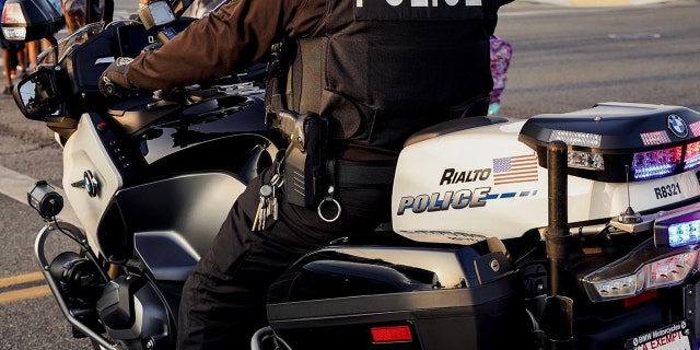 A Rialto Police Department officer on a motorcycle.