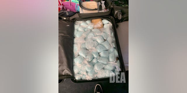 A bag of recently confiscated counterfeit tablets made of fentanyl captured by the US Drug Enforcement Department is shown here.