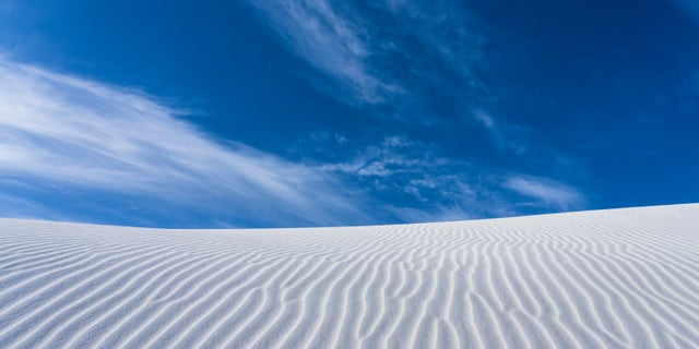 Ripple patterns and blue sky in White Sands National Park, New Mexico.