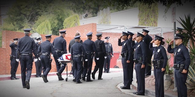 Police attend the funeral for officer Houston Tipping, who was killed in training (LAPD.