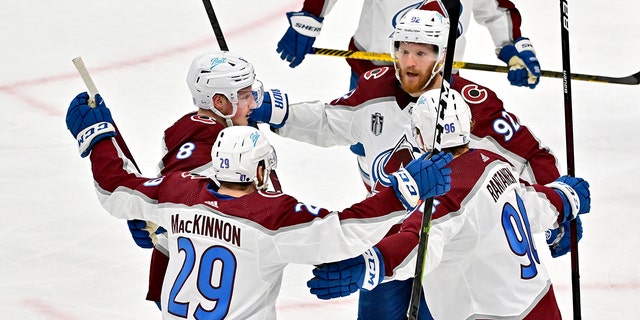 Gabriel Landeskog (92) of the Colorado Avalanche celebrates with teammates after a goal against the Tampa Bay Lightning during the second period in Game 4 of the 2022 NHL Stanley Cup Final at Amalie Arena on June 22, 2022 in Tampa, Fla. .