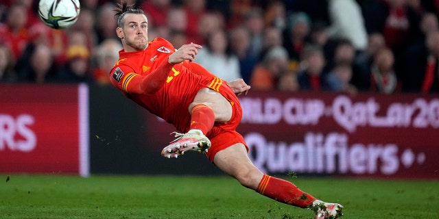 Wales' Gareth Bale takes a shot during a World Cup 2022 playoff soccer match between Wales and Austria at Cardiff City stadium in Cardiff, Britain, March 24, 2022.