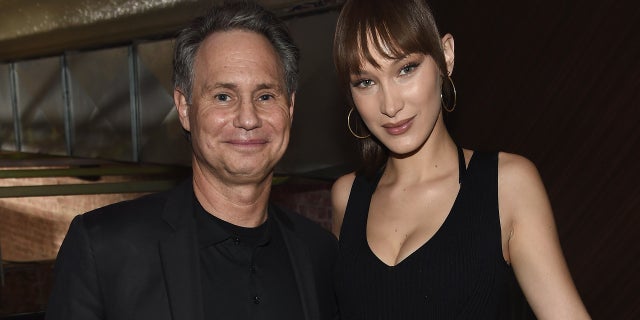 Jason Binn (L) and Bella Hadid attends the Jump Into Spring: MICHAEL Michael Kors Spring 2019 Launch Party at Dolby Soho on February 5, 2019 in New York City.