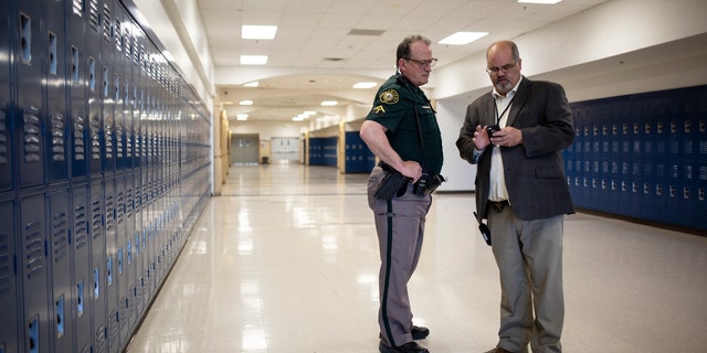 An officer at Columbine High School in 2019.