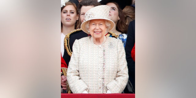 Queen Elizabeth II watches a flypast from the balcony of Buckingham Palace during Trooping The Colour, the Queen's annual birthday parade, on June 8, 2019 in London, England.