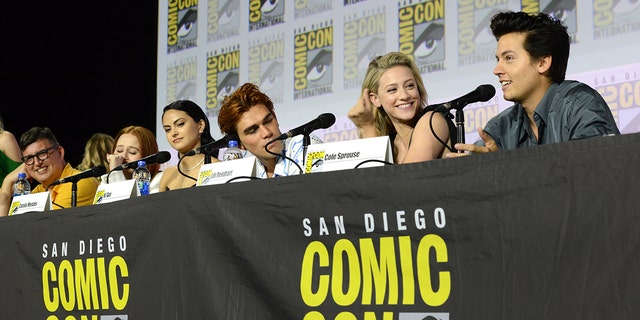 Camila Mendes, KJ Apa, Lili Reinhart, and Cole Sprouse speak at the "Riverdale" Special Video Presentation and Q&amp;A during 2019 Comic-Con International at San Diego Convention Center on July 21, 2019, in San Diego, California. 