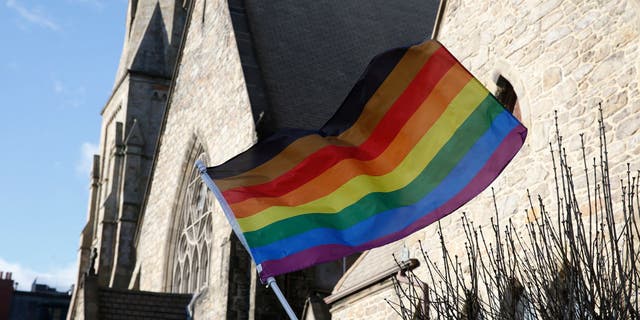 An LGBTQ+ flag flies over Union United Methodist Church in the South End of Boston Jan. 5, 2020.