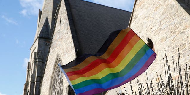 An LGBTQ+ flag flies over Union United Methodist Church in the South End of Boston on Jan. 5, 2020.