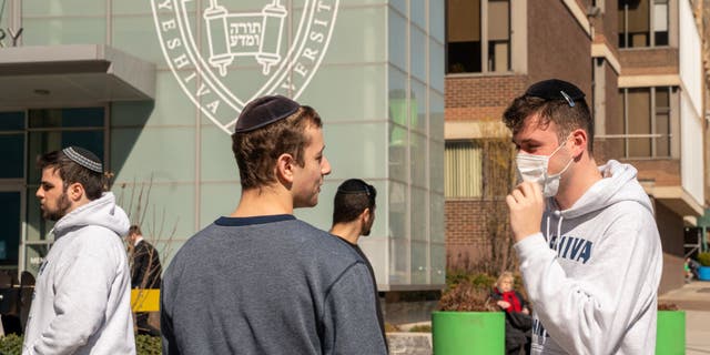 A Yeshiva student wears a face mask on the grounds of the university on March 4, 2020, in New York City.