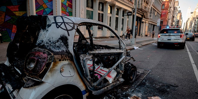 A destroyed NYPD police car is seen after a night of protest over the death of African-American man George Floyd in Minneapolis on June 1, 2020. 