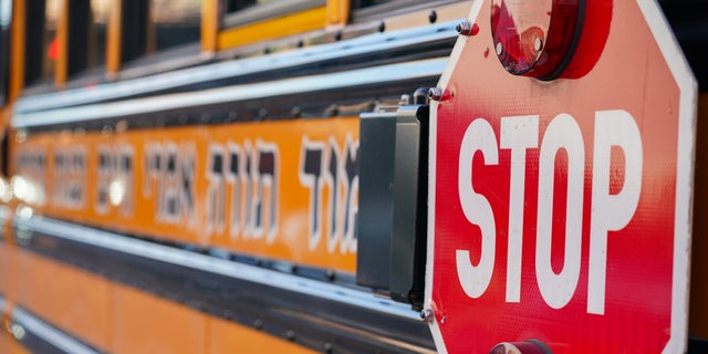 A Yeshiva school bus is seen parked outside a school in Borough Park, a neighborhood in Brooklyn, New York.