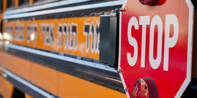 A Yeshiva school bus is seen parked outside a school in Borough Park, a neighborhood in Brooklyn, New York.