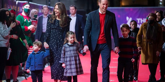 Prince William and Catherine, Duchess of Cambridge with their children, Prince Louis, Princess Charlotte and Prince George, attend a special performance at London's Palladium Theatre to thank workers and their families for their efforts throughout the pandemic on Dec. 11, 2020, in London.