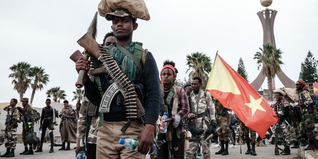 TOPSHOT - Tigray People's Liberation Front (TPLF) fighters prepare to leave for another field at Tigray Martyr's Memorial Monument Center in Mekele, the capital of Tigray region, Ethiopia, on June 30, 2021. 