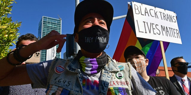 People rally in support of the Netflix transgender walkout in Los Angeles, California on October 20, 2021. 