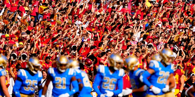 USC Trojans fans cheer against the UCLA Bruins at the Los Angeles Memorial Coliseum on Nov. 20, 2021.