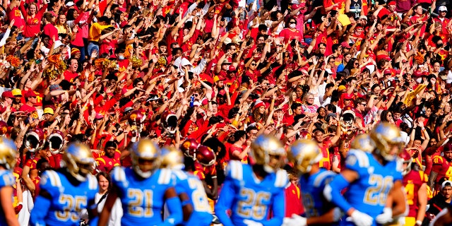 USC Trojans fans cheer against the UCLA Bruins at the Los Angeles Memorial Coliseum on Nov. 20, 2021.