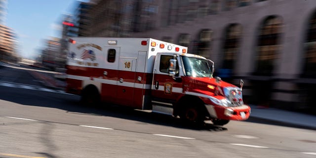 An ambulance drives through Washington, DC, on February 5, 2022. 