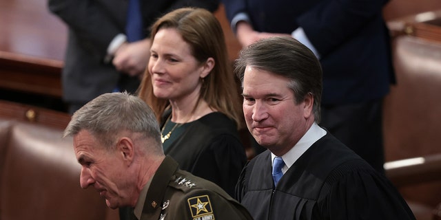 Brett Kavanaugh, associate justice of the U.S. Supreme Court, right, before a State of the Union address by U.S. President Joe Biden at the U.S. Capitol in Washington, D.C., U.S., on Tuesday, March 1, 2022. 