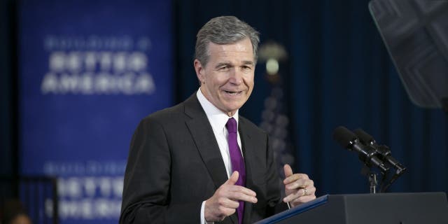 North Carolina Governor Roy Cooper speaks  before President Joe Biden speaks to guests during a visit to North Carolina Agricultural and Technical State University on April 14, 2022 in Greensboro, North Carolina.