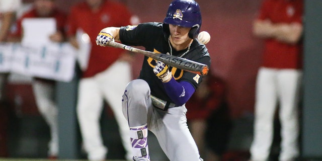 East Carolina Pirates outfielder Bryson Worrell bunts against the NC State Wolfpack on April 26, 2022, in Raleigh, North Carolina.