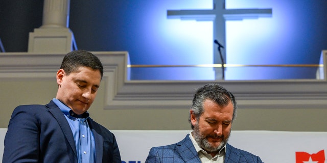 Josh Mandel, U.S. Republican senate candidate for Ohio, left, and Senator Ted Cruz, a Republican from Texas, pray during a 'Faith &amp; Freedom' rally in Columbus, Ohio, U.S., on Saturday, April 30, 2022. 