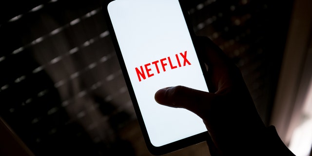 In this photo illustration a Netflix logo seen displayed on a smartphone screen in Athens, Greece on May 4, 2022. (Photo by Nikolas Kokovlis/NurPhoto via Getty Images)