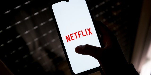 In this photo illustration a Netflix logo seen displayed on a smartphone screen in Athens, Greece on May 4, 2022. (Photo by Nikolas Kokovlis/NurPhoto via Getty Images)