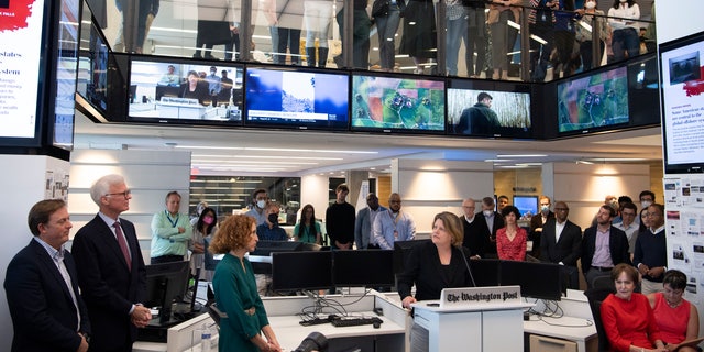 The Washington Post via Getty Images Executive Editor, Sally Buzbee speaks after the paper was awarded the 2022 Pulitzer Prize for Public Service as employees of The Washington Post via Getty Images gather in the newsroom to watch the presentations on Monday May 09, 2022 in Washington, DC. 