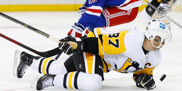 Pittsburgh Penguins center Sidney Crosby on the ice after being hit by Rangers defenseman Jacob Trouba on May 11, 2022, at Madison Square Garden in New York City.