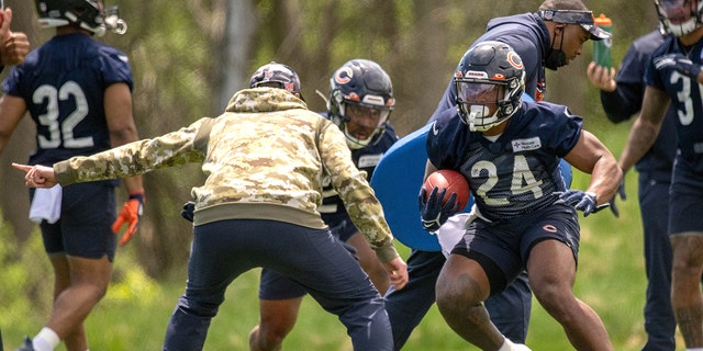 Chicago Bears running back Khalil Herbert (24) runs with the football in action during the Chicago Bears OTA Offseason Workouts on May 17, 2022, at Halas Hall in Lake Forest, IL. 