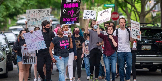 Pro-choice activists approach the Chevy Chase, Maryland, home of U.S. Supreme Court Justice Brett Kavanaugh to hold a demonstration.