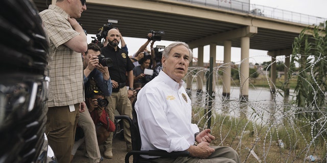 Greg Abbott, governor of Texas, tours the border between the U.S. and Mexico along the Rio Grande in Eagle Pass, Texas, May 23, 2022.  