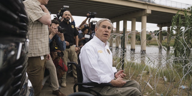 Greg Abbott, governor of Texas, tours the border between the U.S. and Mexico along the Rio Grande in Eagle Pass, Texas, May 23, 2022.  