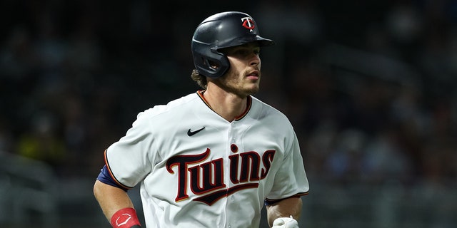 Max Kepler #26 of the Minnesota Twins advances to first base on a walk against the Detroit Tigers in the ninth inning at Target Field on May 23, 2022 in Minneapolis, Minnesota. The Twins defeated the Tigers 5-4. 