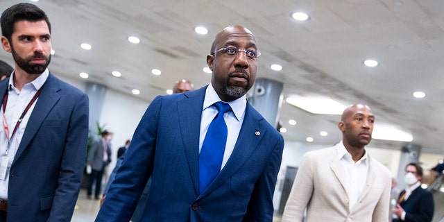 Democratic Sen.  Raphael Warnock of Georgia is seen in the US Capitol before the Senate luncheons, on Tuesday, May 24, 2022. 