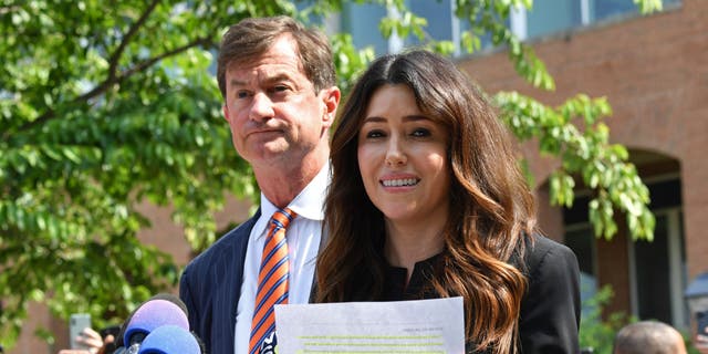 Johnny Depp's lawyers Ben Chew (L) and Camille Vasquez, address the media outside the Fairfax County Circuit Courthouse in Fairfax, Virginia, on June 1, 2022.